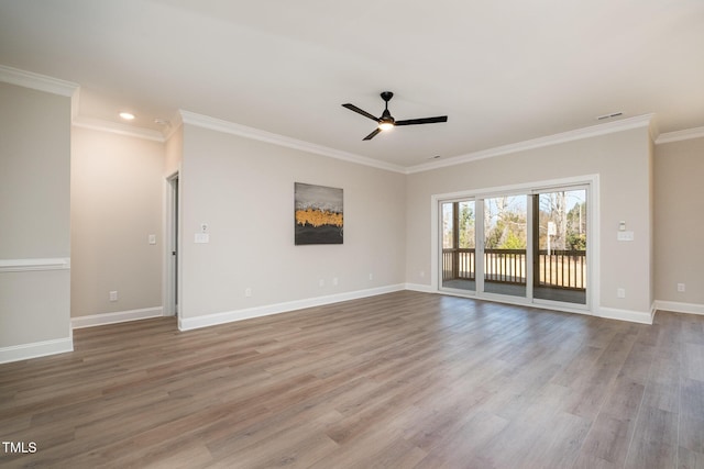 spare room with light wood-type flooring, ceiling fan, and ornamental molding