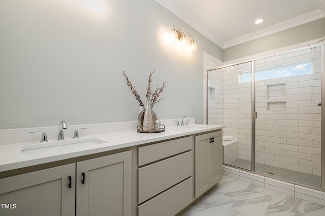 bathroom with vanity, a shower with shower door, and crown molding