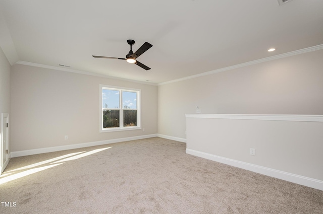 carpeted empty room with ceiling fan and ornamental molding