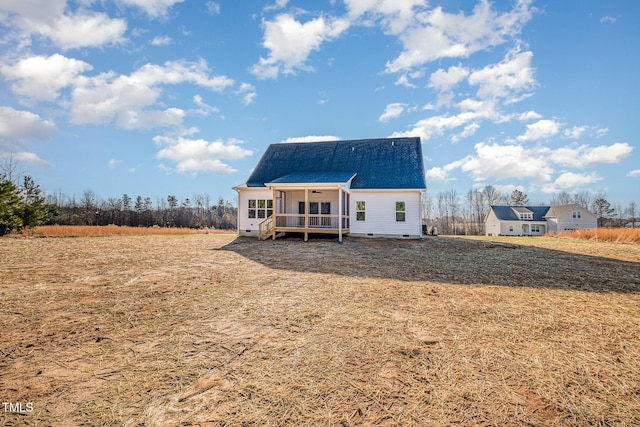 back of property featuring a deck