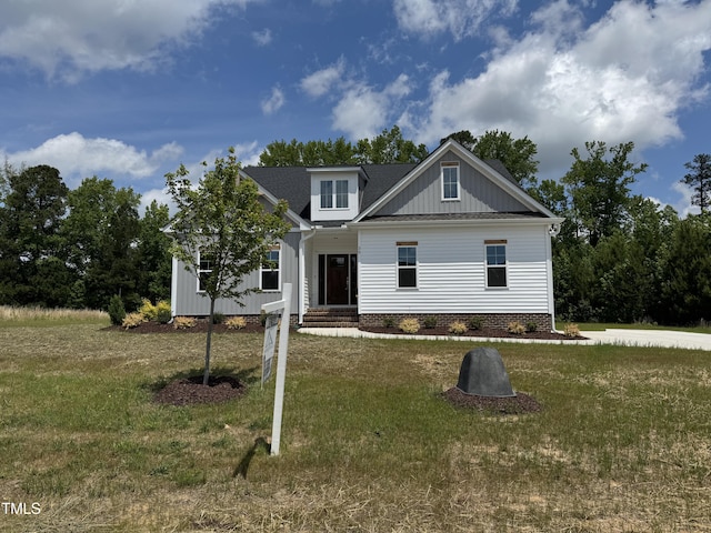 35 Uptown Rd, Zebulon, NC 27597 - view of front of home featuring a front lawn and crawl space