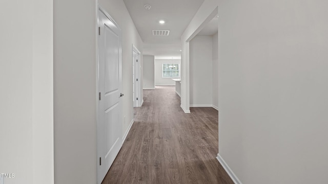 hall featuring dark wood-type flooring