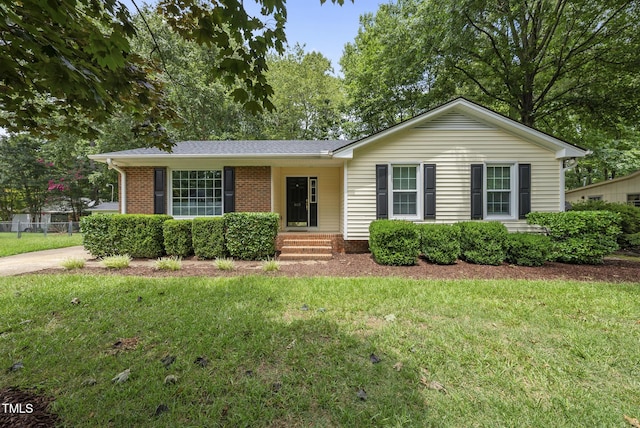 603 E Park St, Cary, NC 27511 - ranch-style home with a front lawn, brick siding, and a shingled roof