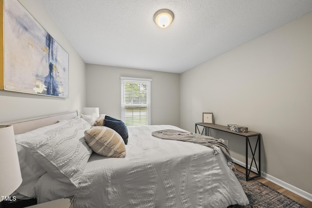 603 E Park St, Cary, NC 27511 - bedroom with wood finished floors and a textured ceiling
