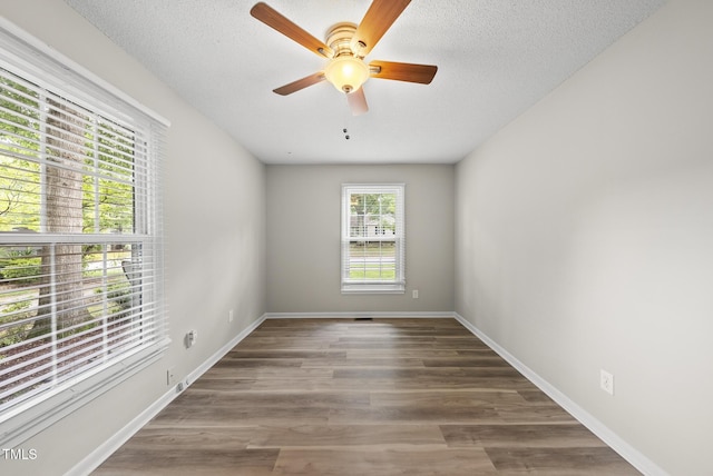 603 E Park St, Cary, NC 27511 - spare room featuring ceiling fan, wood finished floors, and a textured ceiling