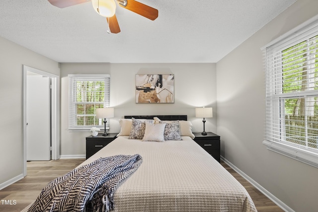 603 E Park St, Cary, NC 27511 - bedroom with wood finished floors, ceiling fan, and a textured ceiling