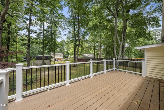 603 E Park St, Cary, NC 27511 - deck with a fenced backyard, an outbuilding, and view of scattered trees