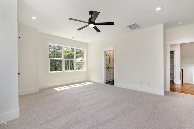 unfurnished bedroom featuring baseboards, recessed lighting, visible vents, and carpet