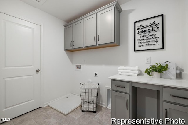 washroom featuring cabinets, electric dryer hookup, and hookup for a washing machine