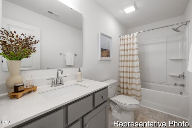 full bathroom with vanity, toilet, and shower / bath combo with shower curtain