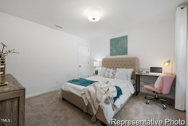 bedroom featuring light carpet