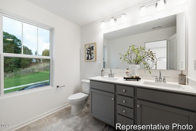 bathroom with vanity and toilet