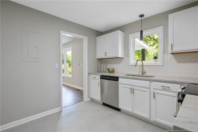 kitchen featuring white cabinets, dishwasher, a healthy amount of sunlight, and sink