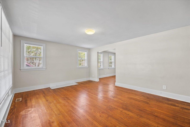 empty room featuring hardwood / wood-style flooring