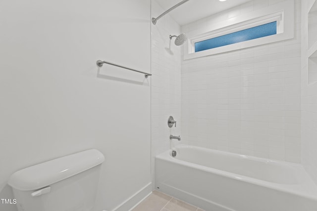 bathroom featuring toilet, shower / tub combination, baseboards, and tile patterned floors