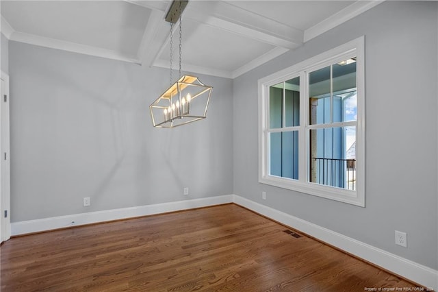 spare room featuring ornamental molding, beamed ceiling, a chandelier, and wood-type flooring