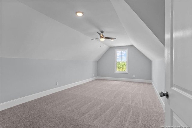 bonus room featuring ceiling fan, light colored carpet, and vaulted ceiling