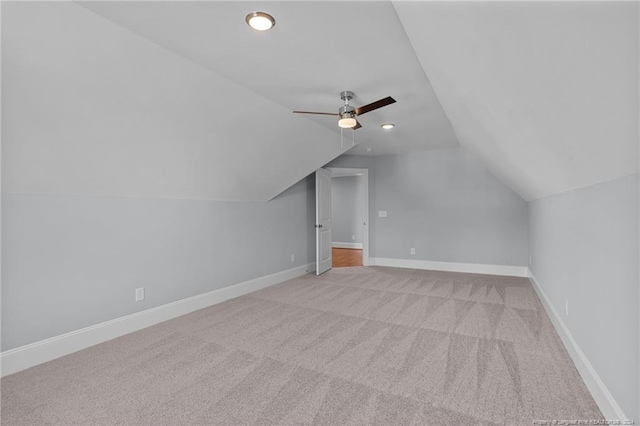 bonus room featuring light colored carpet, ceiling fan, and lofted ceiling