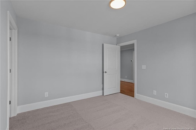 unfurnished bedroom featuring light colored carpet