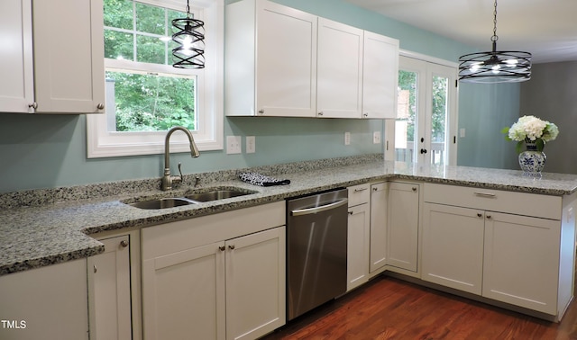 kitchen featuring dishwasher, a healthy amount of sunlight, kitchen peninsula, and dark hardwood / wood-style floors