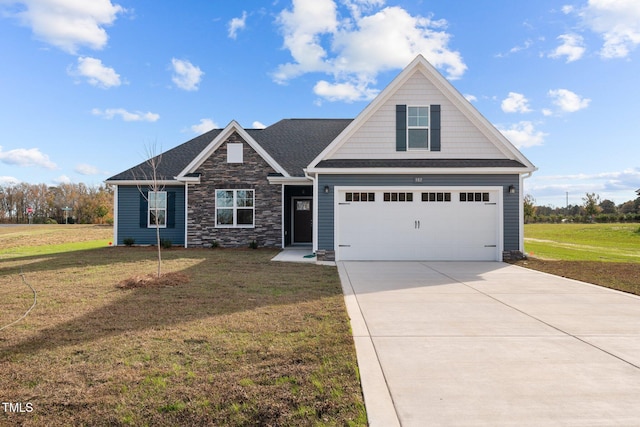 craftsman-style house with a garage and a front lawn