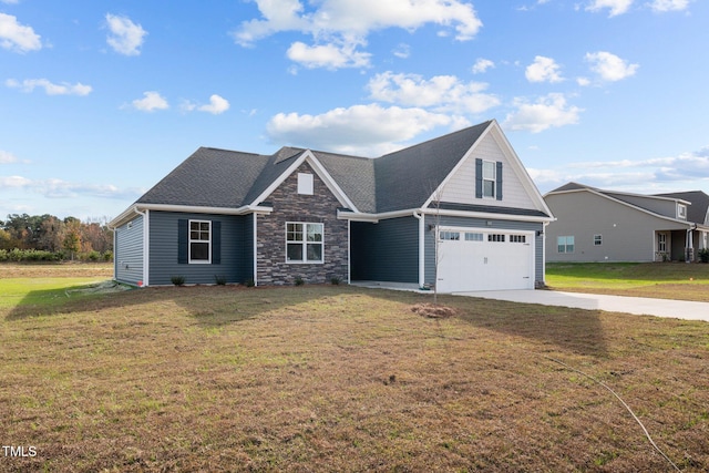 view of front of house featuring a front lawn and a garage