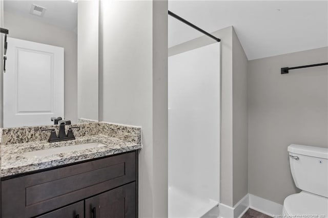 full bathroom with baseboards, visible vents, toilet, walk in shower, and vanity