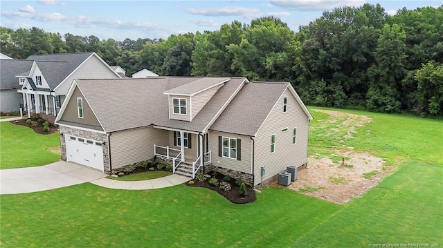 view of front of home with crawl space, central air condition unit, a front lawn, and concrete driveway