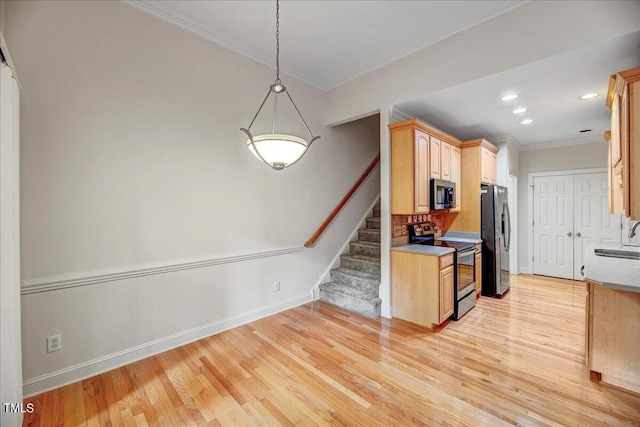 kitchen with crown molding, light hardwood / wood-style flooring, light brown cabinets, decorative light fixtures, and appliances with stainless steel finishes