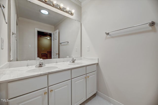 bathroom featuring ornamental molding, tile patterned flooring, and vanity