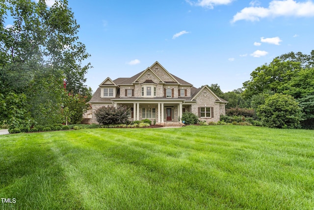 view of front of property featuring a porch and a front yard