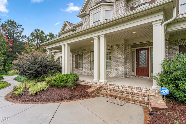 doorway to property featuring covered porch