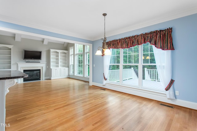 unfurnished dining area with light hardwood / wood-style flooring, a chandelier, and vaulted ceiling with beams