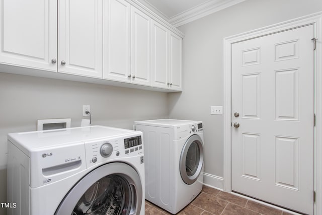 washroom with crown molding, cabinets, and washing machine and dryer