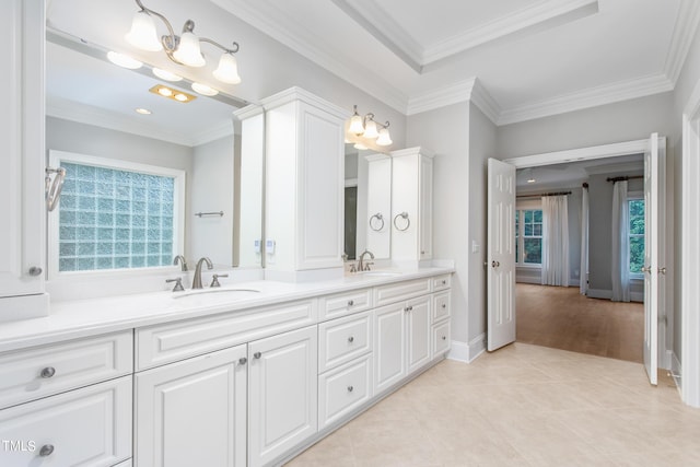 bathroom with vanity, crown molding, and tile patterned flooring