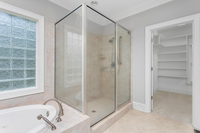 bathroom featuring ornamental molding, tile patterned floors, and shower with separate bathtub