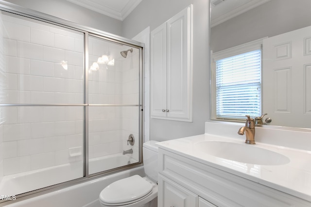 full bathroom featuring bath / shower combo with glass door, toilet, vanity, and ornamental molding