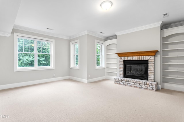 unfurnished living room with a brick fireplace, built in features, carpet floors, and ornamental molding