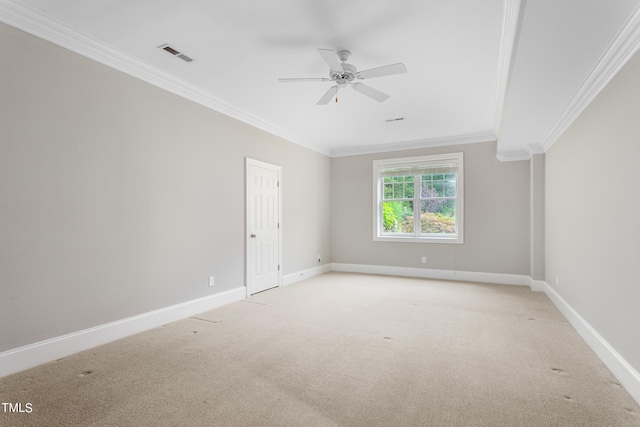 carpeted empty room with ceiling fan and ornamental molding