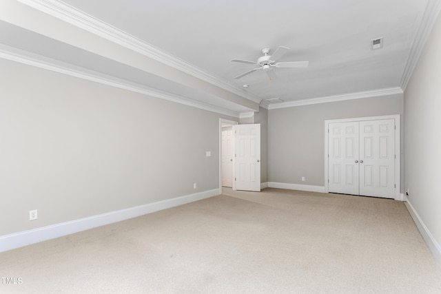 unfurnished bedroom with carpet flooring, a closet, ceiling fan, and ornamental molding