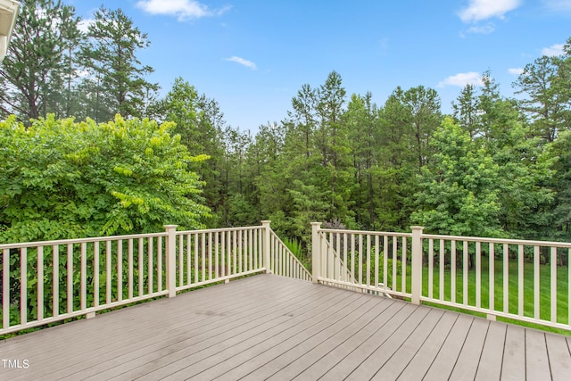 deck featuring a lawn