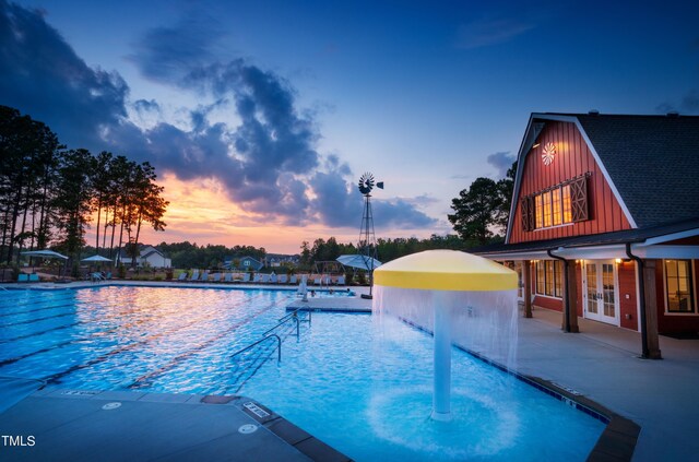 community pool featuring a patio and french doors