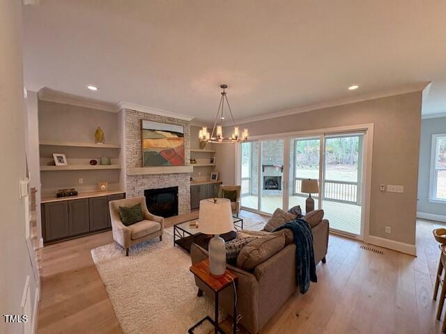 living area with crown molding, visible vents, a stone fireplace, light wood-type flooring, and baseboards