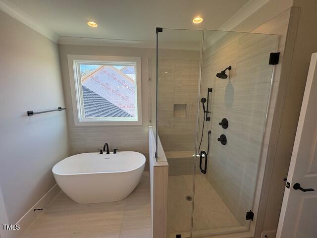 bathroom with separate shower and tub