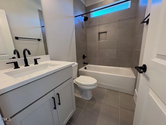 full bathroom with vanity, toilet, tile patterned floors, and tiled shower / bath