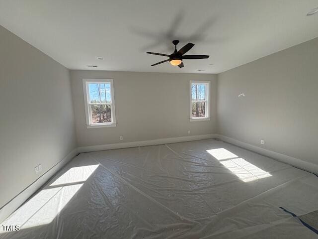 spare room with ceiling fan