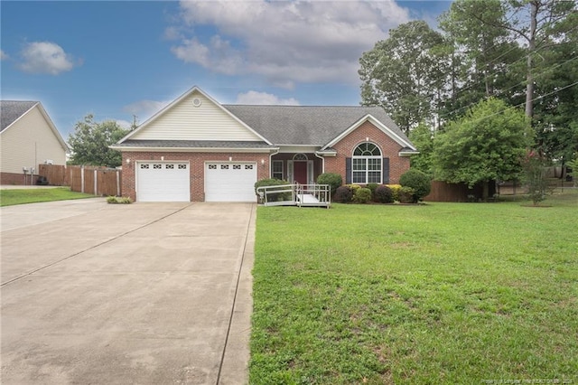 single story home featuring brick siding, an attached garage, fence, a front yard, and driveway