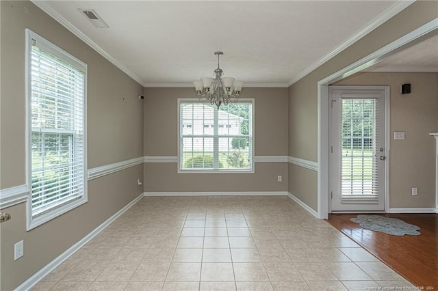 unfurnished dining area with visible vents, baseboards, ornamental molding, an inviting chandelier, and light tile patterned flooring