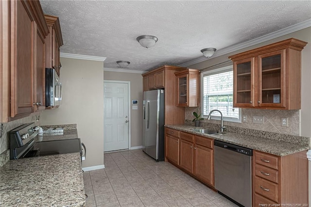 kitchen with sink, light stone countertops, stainless steel appliances, and light tile patterned floors