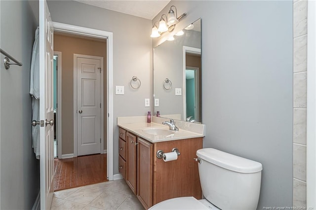 bathroom featuring vanity, wood-type flooring, and toilet